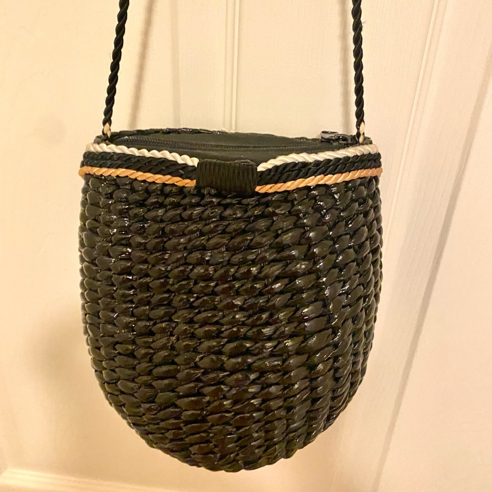 Black/gold woven rattan mini shoulder bag.